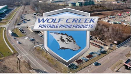 Wolf Creek Portable Piping products logo over the building